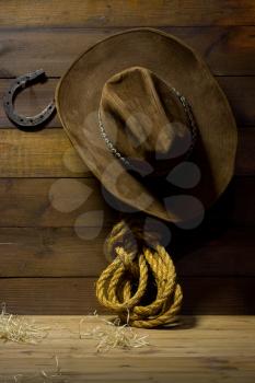 Accessories cowboy hanging on old wooden wall ranch