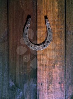 steel classic horseshoe lying on a dark wooden background