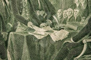 close-up image of a fragment of the Declaration of Independence on the back of a US two dollar bill