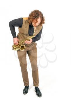 young saxophonist playing his bronze saxophone isolated on white background