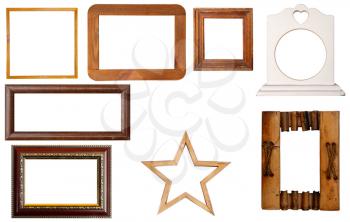 Several vintage frames for photos or pictures of different shapes isolated on white and with a rough paper backing in the center