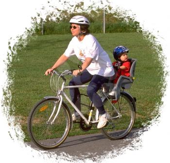 Royalty Free Photo of a Mother and Child on a Bike