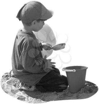 Royalty Free Photo of a Small Child Playing in the Sand