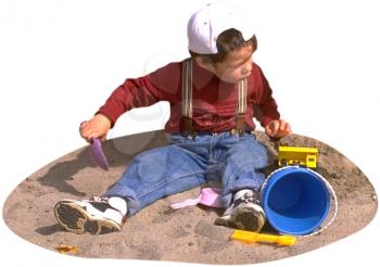 Royalty Free Photo of a Boy Playing in the Sand