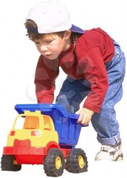 Royalty Free Photo of a Young Boy Playing with a Toy