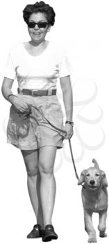 Royalty Free Photo of a Woman Walking a Dog on a Leash
