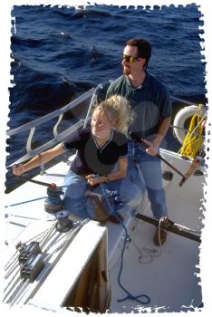 Royalty Free Photo of a Couple on a Sail Boat