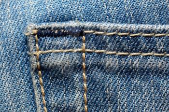 Macro shoot of blue jeans pocket.