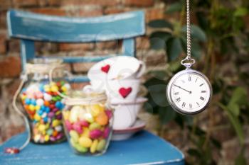 Tea party At The Garden With Watch Hanging
