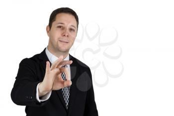 Businessman in Black Suit Doing Ok Sign. Focus On The Hand. Isolated On White Background