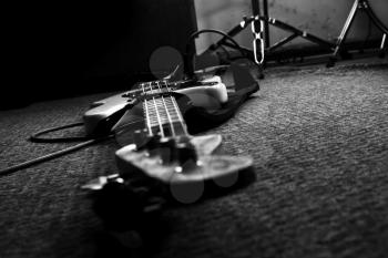 Bass Guitar In Music Studio. Musical Instruments and Equipment