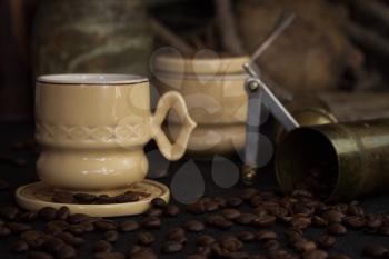 Vintage Coffee Cup, Pot, Grinder With Coffee Beans On a Rustic Wooden Surface
