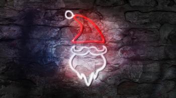 Santa Claus Glowing Neon Sign Against Brick Wall. Happy New Year 2020