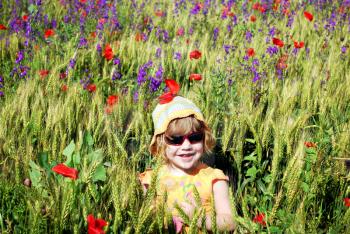 Beauty little girl on the meadow