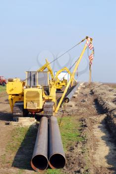 Construction site with gas pipeline and heavy machinery