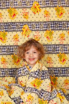 Little girl in colorful linen studio shot