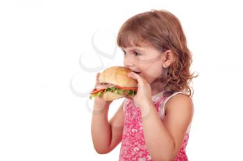 little girl eats big sandwich