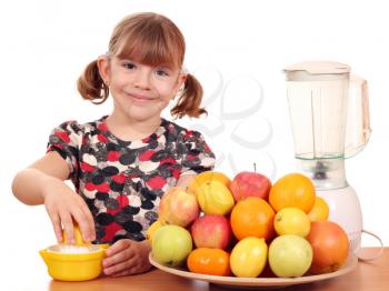happy little girl make fruit juice