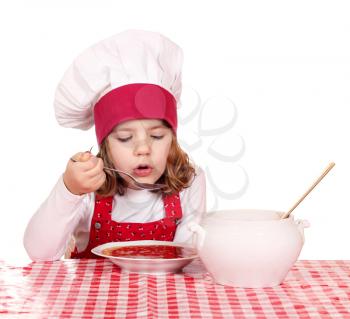 little girl cook eat red tomato soup