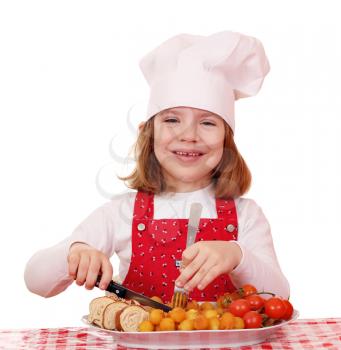 happy little girl cook with gourmet food