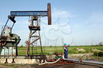 oil worker works on pipeline