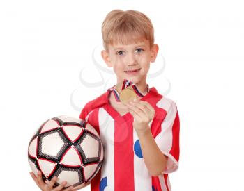 boy with gold medal and soccer ball