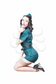 Portrait of Cute Sexy Brunette with black hair. Pin up Female Dressed in military clothing Uniform and Garrison cap. Army Pin-up Girl Concept