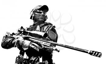 Closeup portrait of police special operations sniper in black blank uniforms and mask, body armor, ballistic goggles and headphones standing on sky background, holding sniper rifle with optical sight