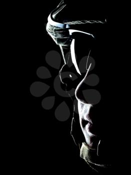 US soldier on the black background with the lot of copyspace
