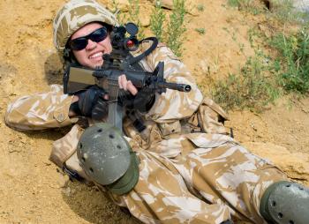 British soldier in desert uniform in action