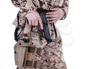 US marine extracting his pistol from a holster