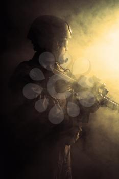 Bearded special forces soldier in the smoke