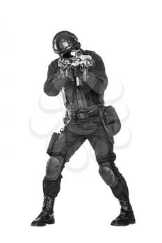 Studio shot of swat police special forces automatic rifle black uniforms aiming criminals. Tactical helmet vest goggles. Isolated on white full body portrait