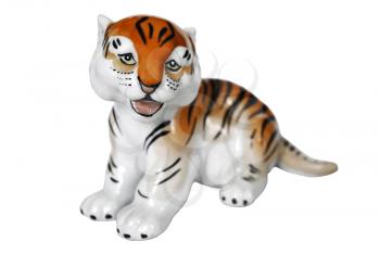 The small tiger from porcelain looks sad eyes.