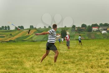 Lviv, Ukraine - July 23, 2017: Unknown aircraft modeler launches his own radio-controlled  model  glider  in the countryside near the city of Lviv., Ukraine.