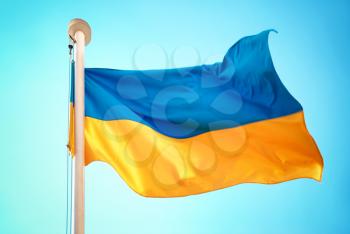 Ukrainian blue and yellow flag on the sky background