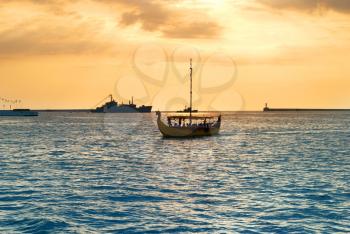 Sailboat on the sea against beautiful sunset