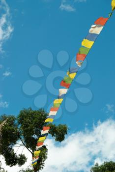 Tibetan prayer colorful flags with the blue sky