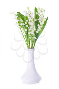 White flowers lilies of the valley in the vase isolated on white background