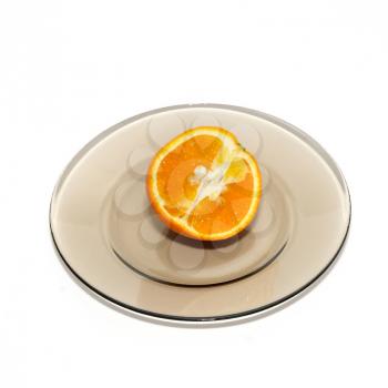 Orange segments on the plate isolated on white.