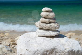 Stone tower with blue sky and sea background