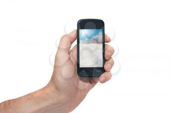 Mobile phone in the hand isolated on white