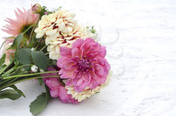 A bouquet of dahlias with a place for the text. Congratulations on your birthday, mother's day,