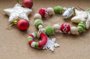Hooked beads with ornament in red-green colors. Composition with New Year's decor.