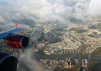 The span of the aircraft over the city, the view from the porthole.