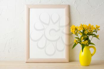 Frame mockup with yellow flowers in stylized pitcher vase . Poster white frame mockup. Empty white frame mockup for presentation design.