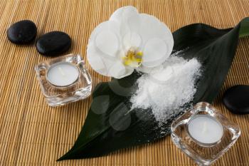 Spa and wellness concept with sea salt and orchid. Spa. Spa stones. Wellness spa. Spa concept