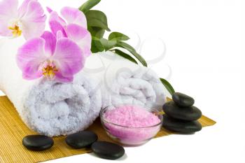 Spa concept with pink orchid isolated on white. Spa. Spa treatment. Spa massage. Spa stones. Wellness spa. Spa concept