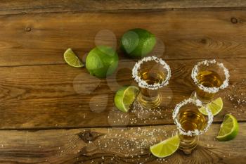 Gold Mexican tequila with lime and salt. Tequila. Tequila shot