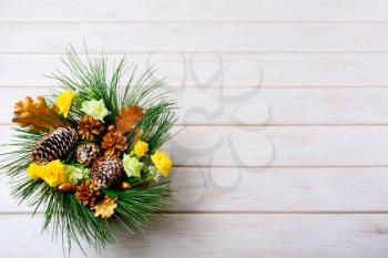 Christmas background with holiday golden cones decorated centerpiece. Christmas decoration with golden decor. Christmas party background.
